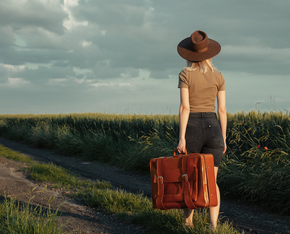 travel nurse walking through cornfield