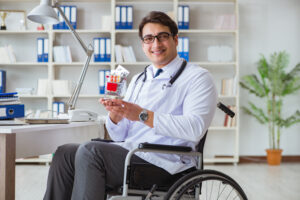 Disabled doctor on wheelchair working in hospital