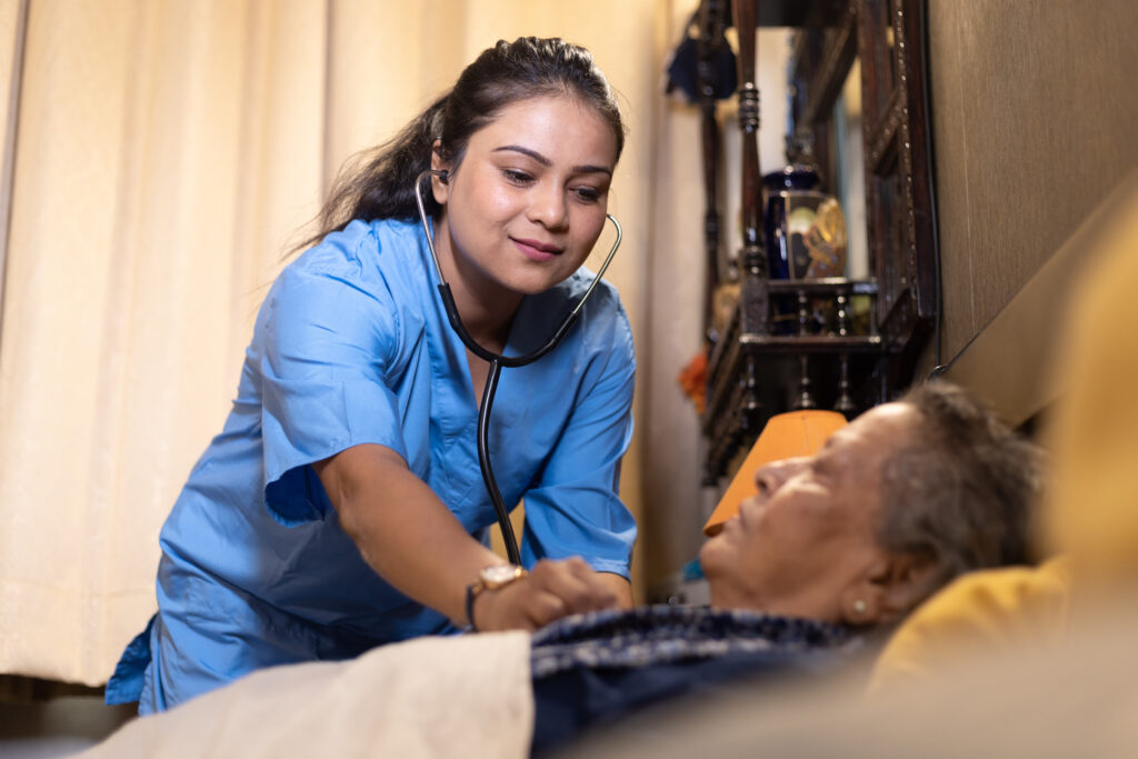 Nurse checking patient at home , home nursing concept