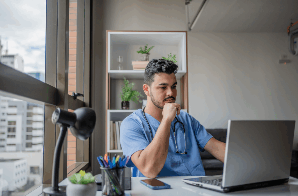 Medical resident on laptop