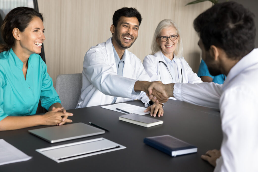 New physician shakes hands