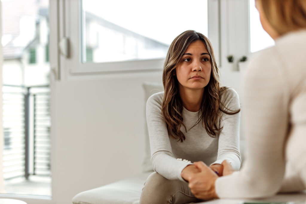 Worried woman receiving care in rural hospital.